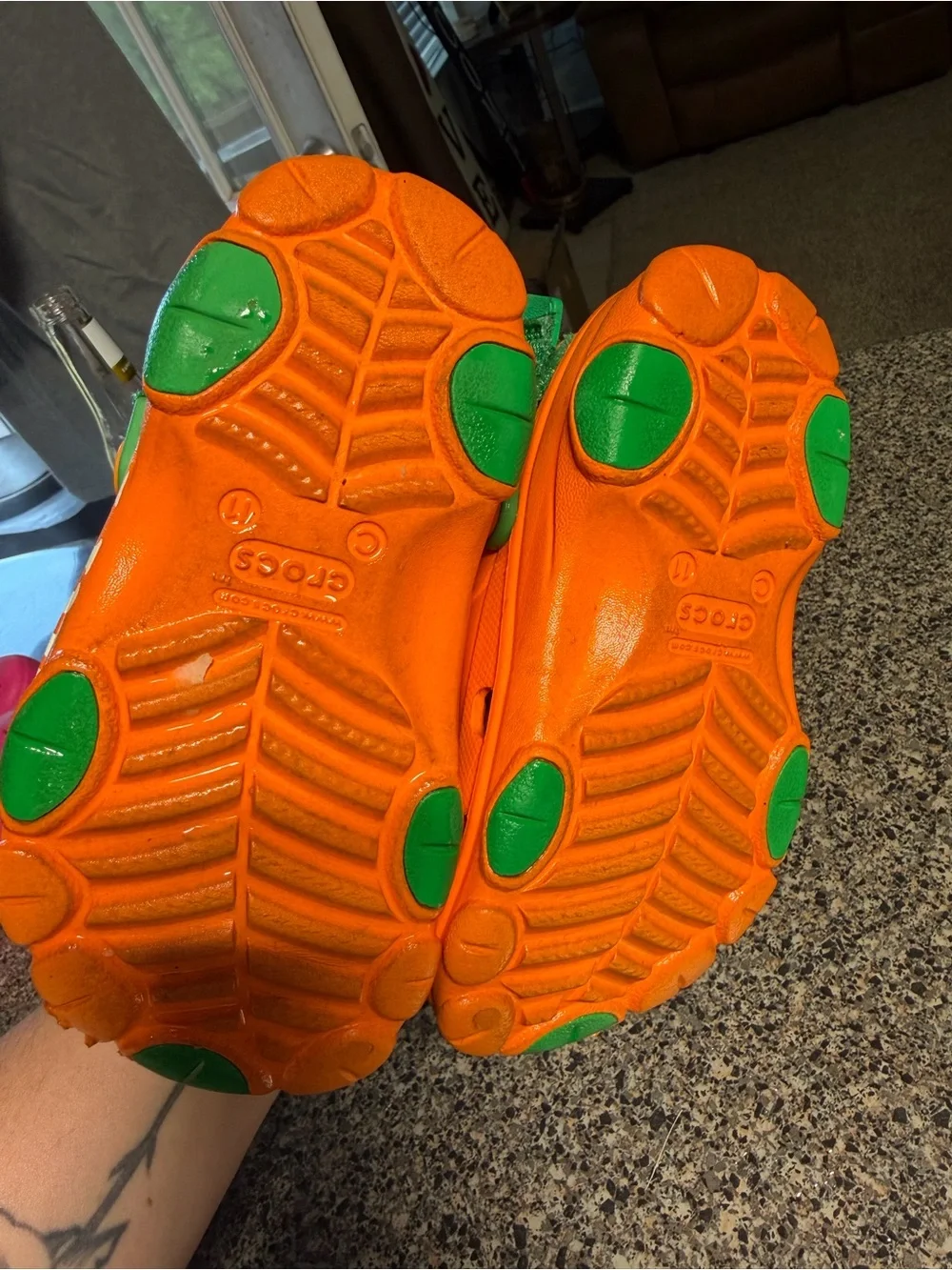 CROCS Kids Orange Clogs with Green Heel Strap